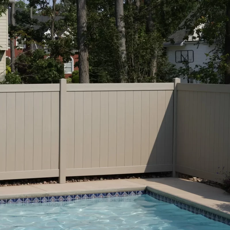 1 Beige fence with swimming pool.