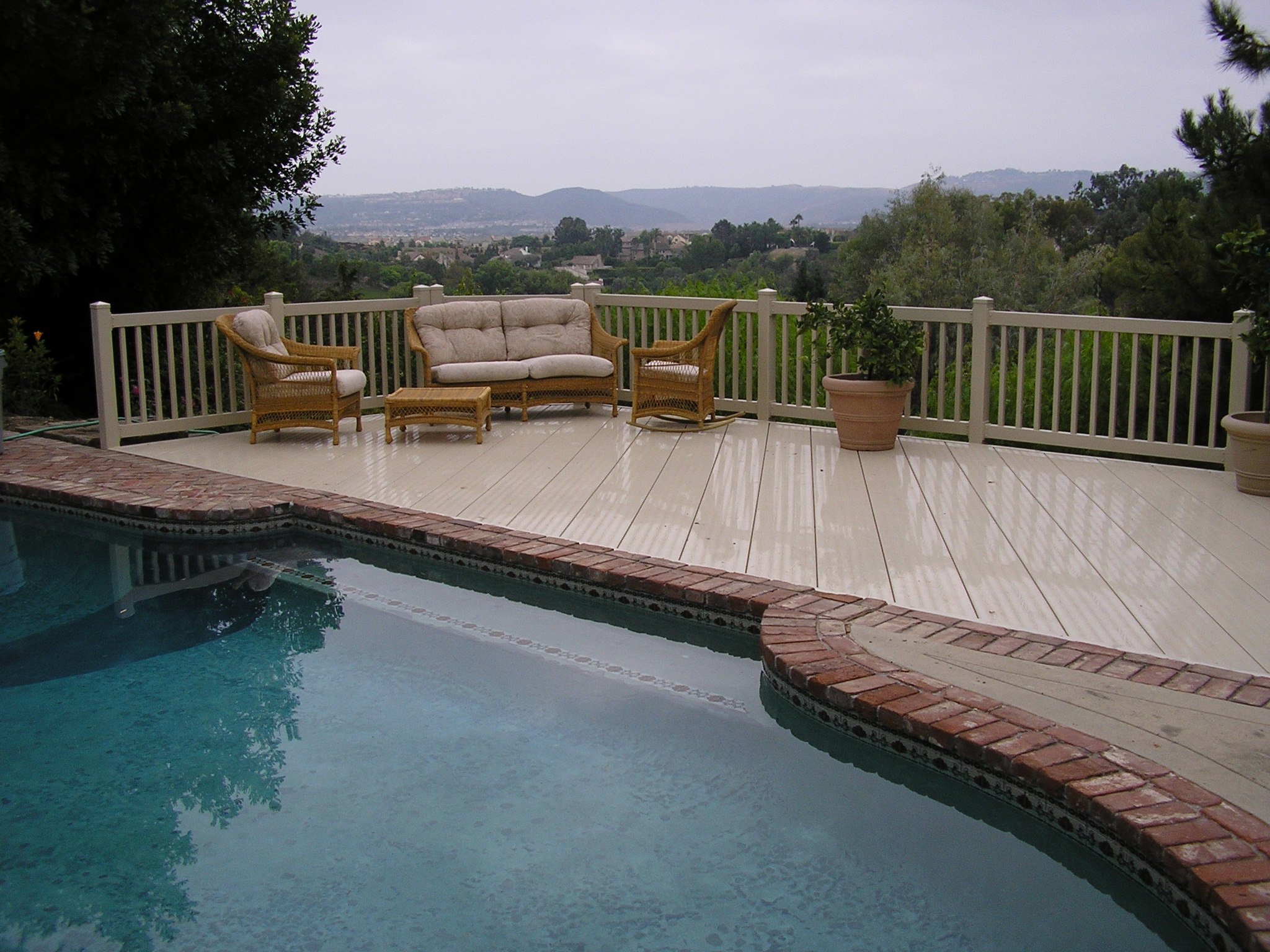 deck16 Deck with railing and a swimming pool