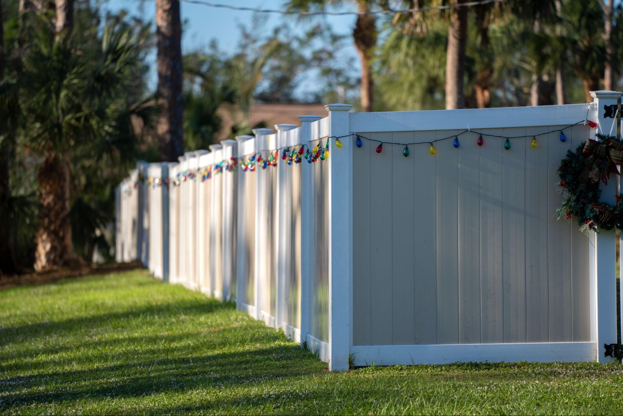 A white vinyl picket fence.