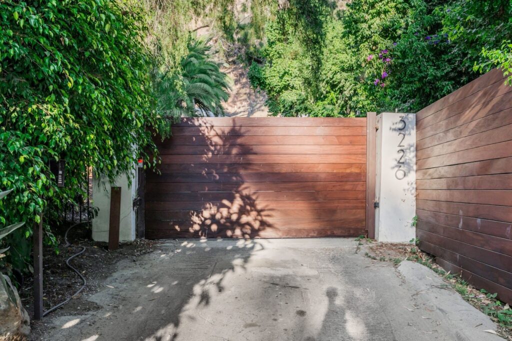 An exterior view of a closed modern gate.