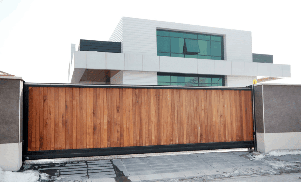 Automatic gated fence, featuring a smooth finish and modern access system.